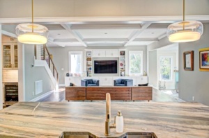 A large open living room with a tv and fireplace.