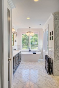 A bathroom with marble floors and walls.