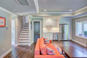 A living room with hard wood floors and a couch.