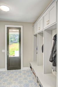 A room with a door and some cabinets