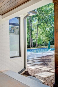 A view of a pool from outside the house.