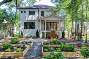 A house with many plants in the yard
