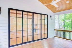 A large room with sliding glass doors and windows.