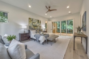 A bedroom with two beds and a couch