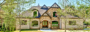 A large house with a lot of windows and doors