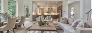 A living room with couches, chairs and tables.