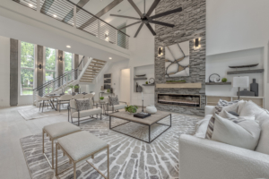 A living room with a fireplace and stone wall.