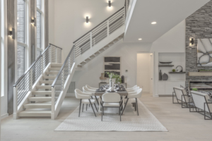 A dining room with stairs and a table