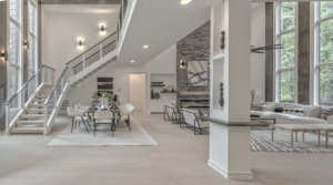 A large open living room with white walls and floors.
