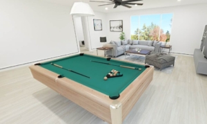 A pool table in the middle of a room with furniture.