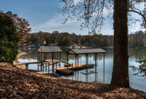 A dock with several small boats on the water.