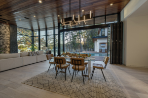 A dining room with a table and chairs in it
