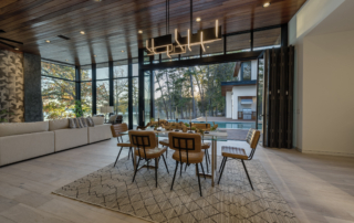 A dining room with a table and chairs in it