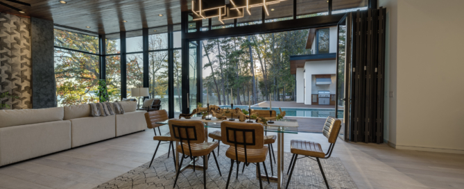Dining room with a table and chairs in a custom-built home by the best construction company, Artistic Contractors.