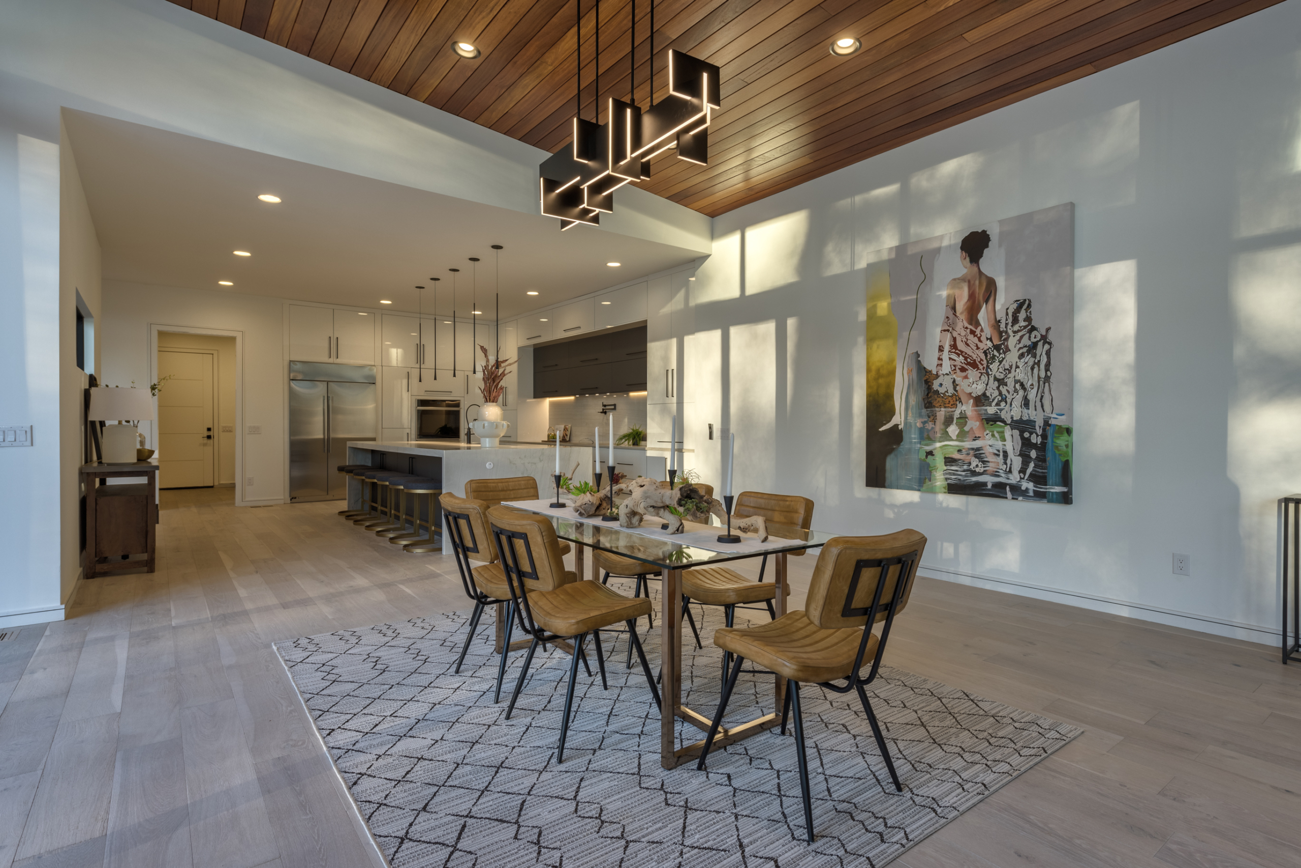 A dining room with a table and chairs in it