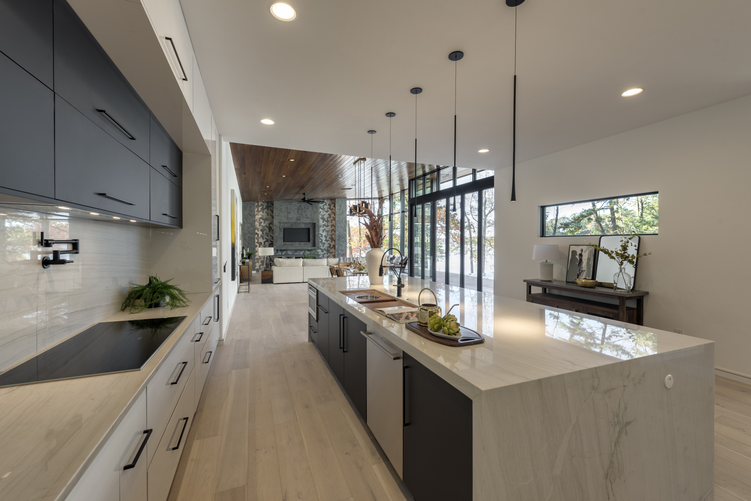 A kitchen with a large island and lots of counter space.