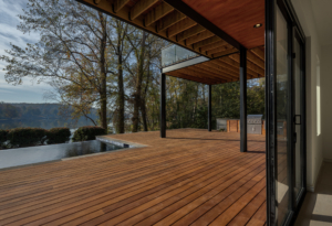 A wooden deck with trees in the background