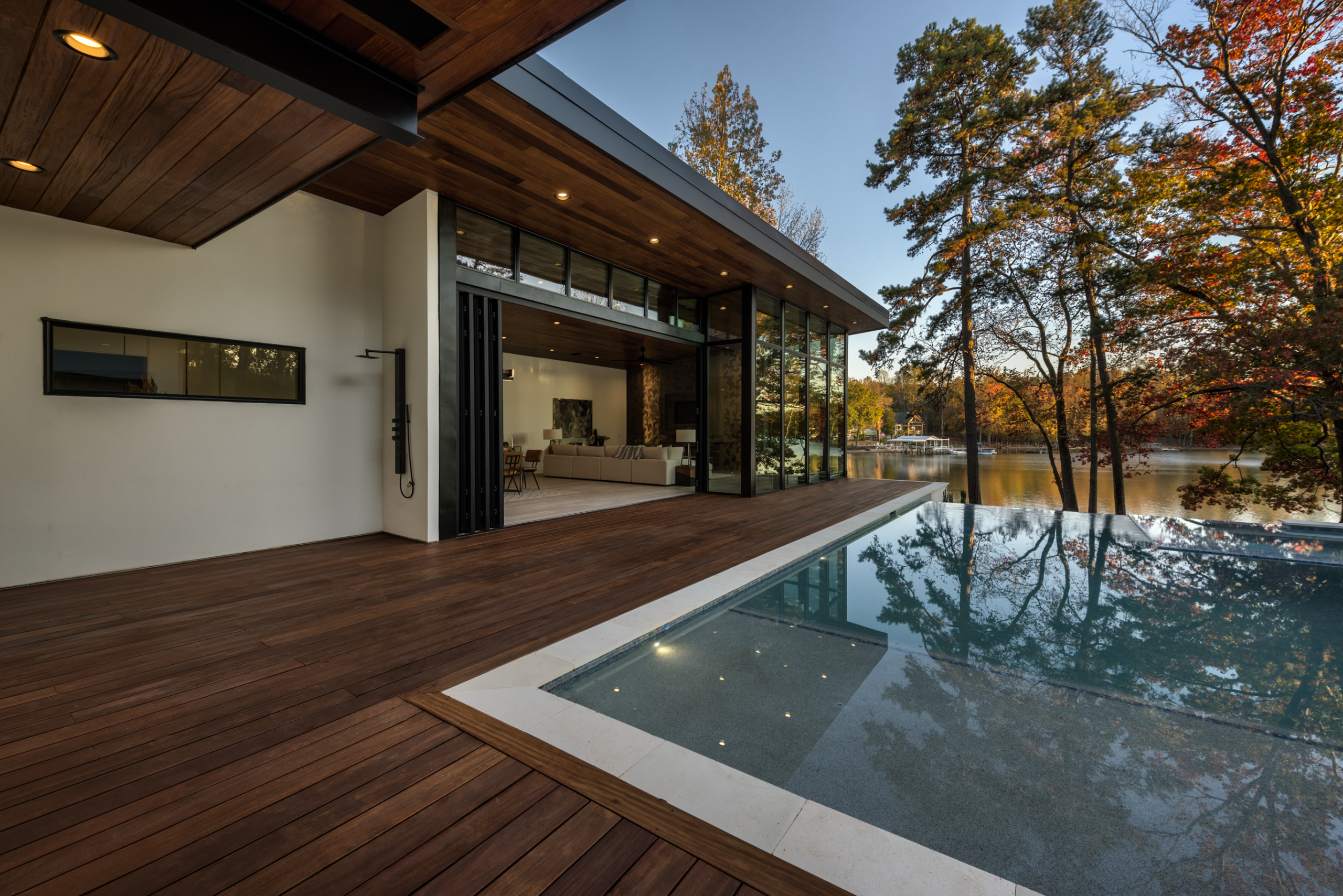 A pool that is in the middle of some wood.