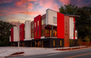 A building with red and white walls on the side of it.