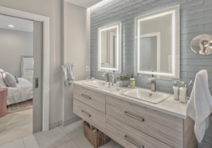 A bathroom with two sinks and mirrors.