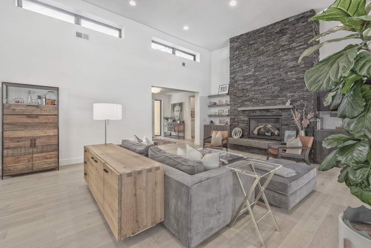 A living room with a couch and fireplace