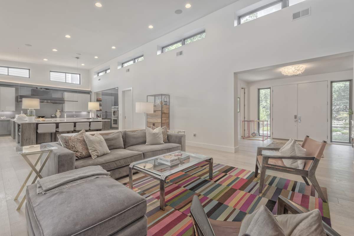 A living room with couches and tables in it