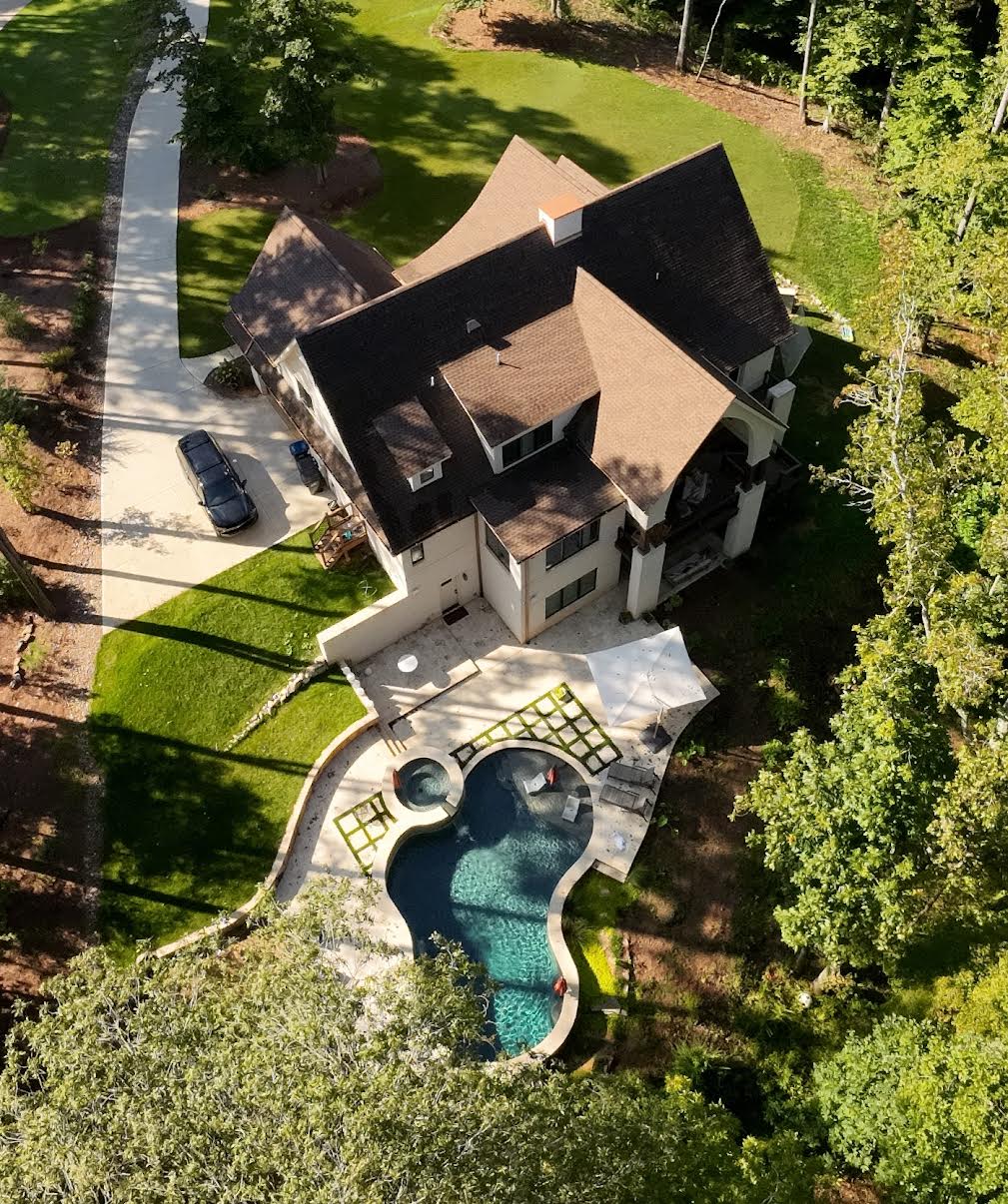 Modern Farmhouse aerial view with backyard pool, hot tub, and paver patio