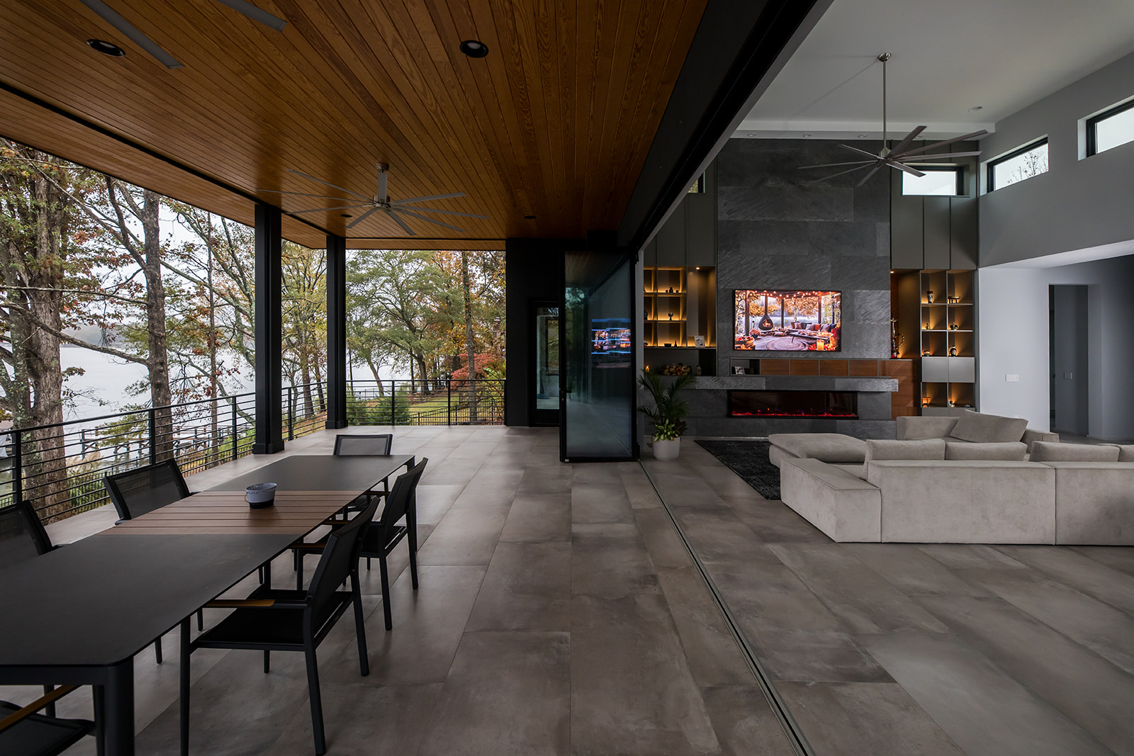 Modern outdoor dining area with folding french glass doors