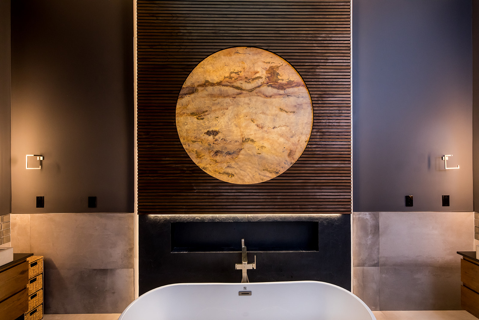 Modern bathroom with freestanding tub and wall marble stone sun moon and wood detail