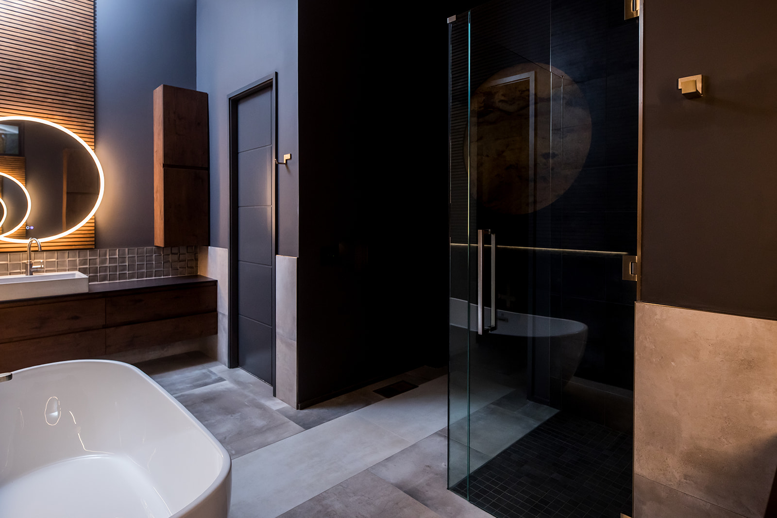 Modern bathroom with glass door shower and circle backlight