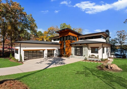 Tidewater, a custom-designed waterfront spec residence on Lake Tillery with Cumaru wood and white stucco, designed and built by Artistic Contractors